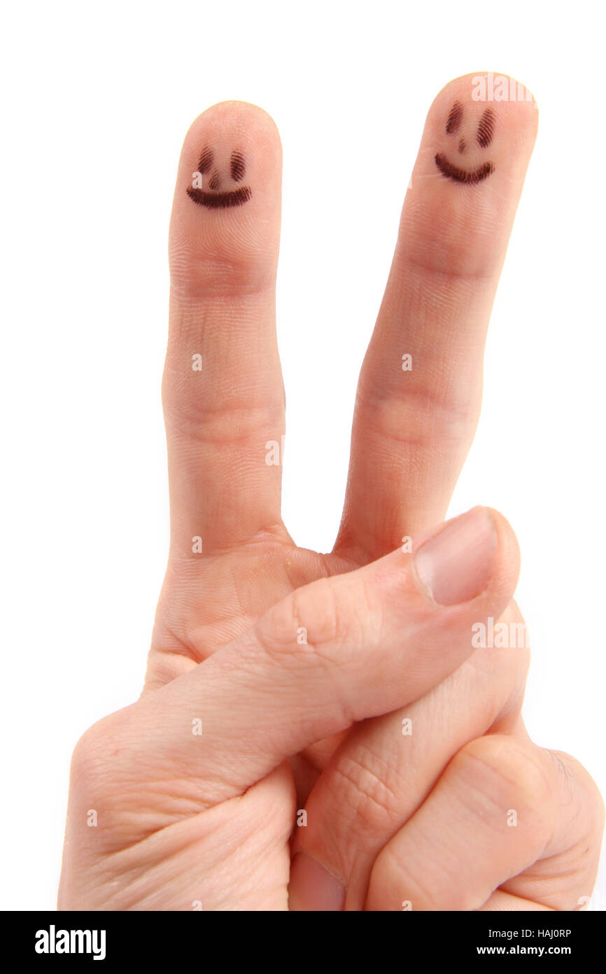 Hand with smileys on fingertips Stock Photo