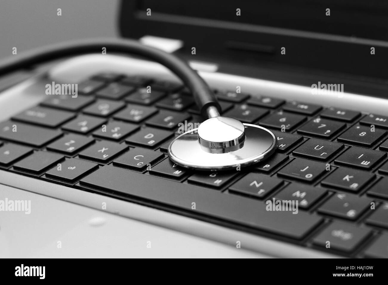 stethoscope on laptop keyboard Stock Photo