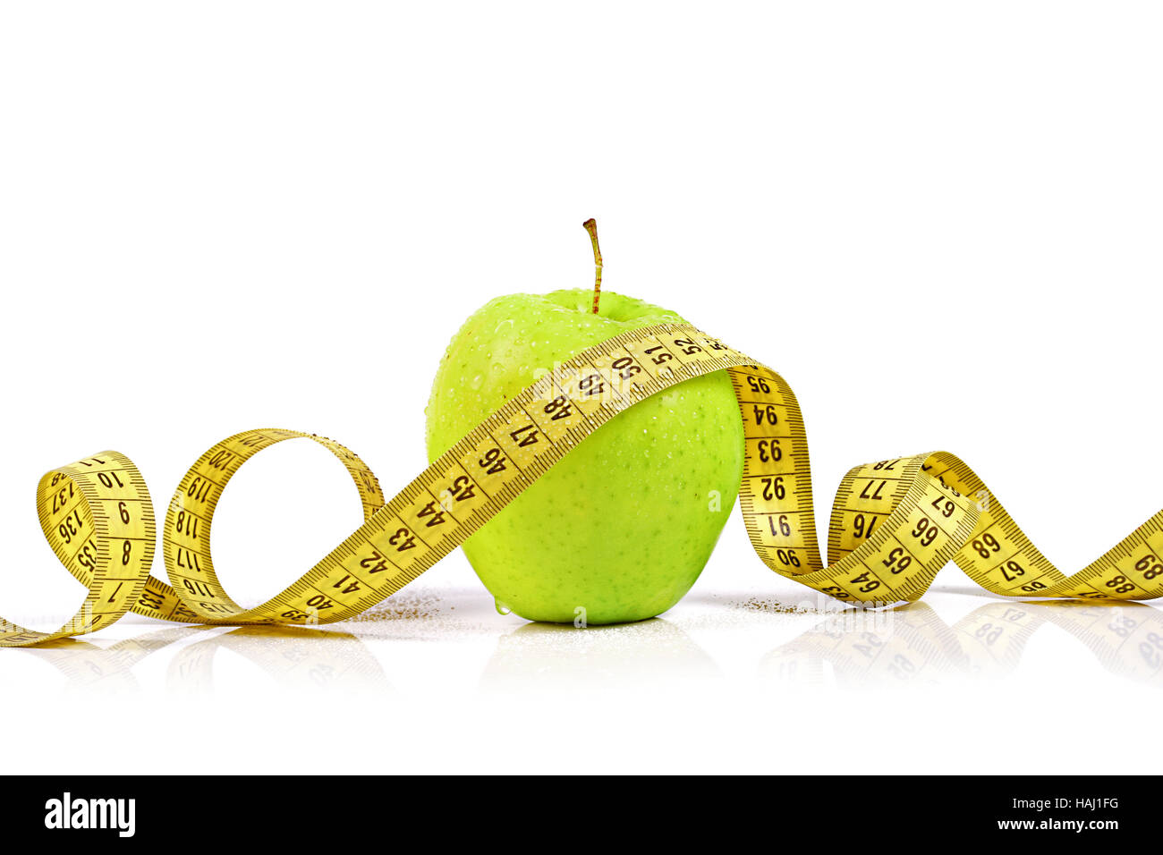 dieting - fresh apple with measuring tape Stock Photo