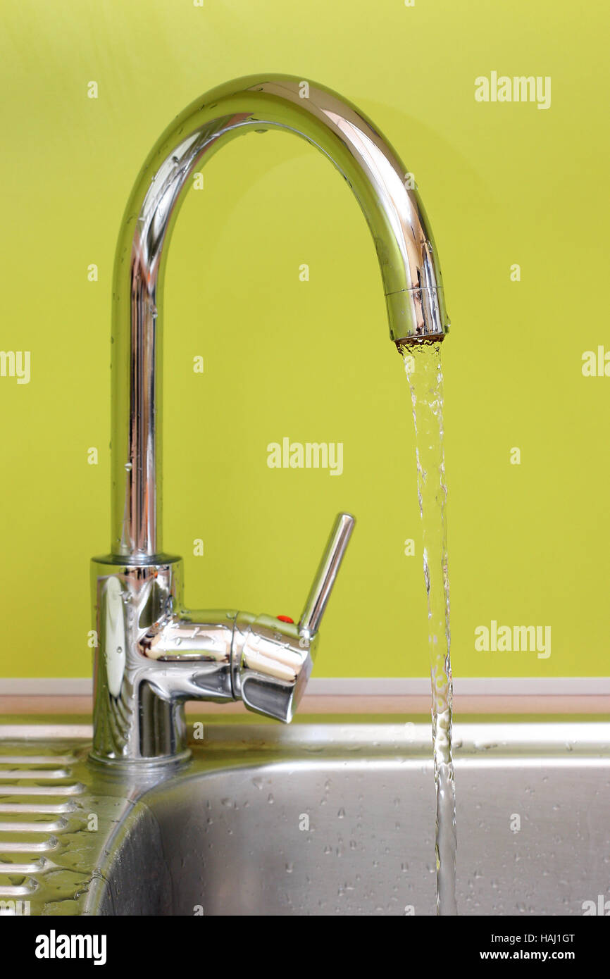 kitchen faucet and sink with running water Stock Photo