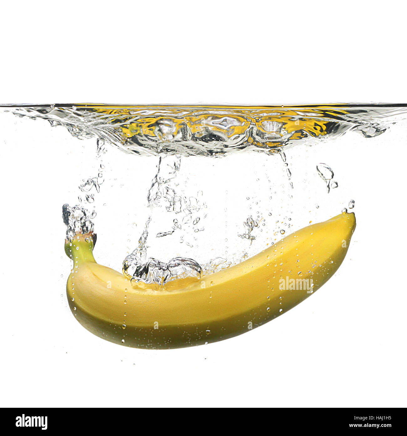 banana with water splash on white Stock Photo