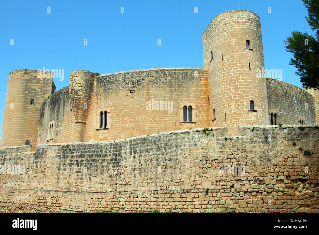 ancient medieval castle against blue sky in Mallorca Stock Photo