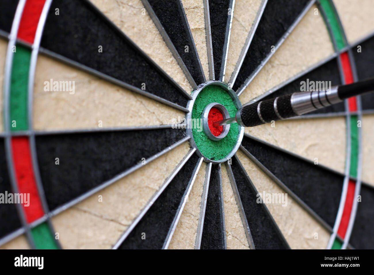 dartboard with dart in the center Stock Photo