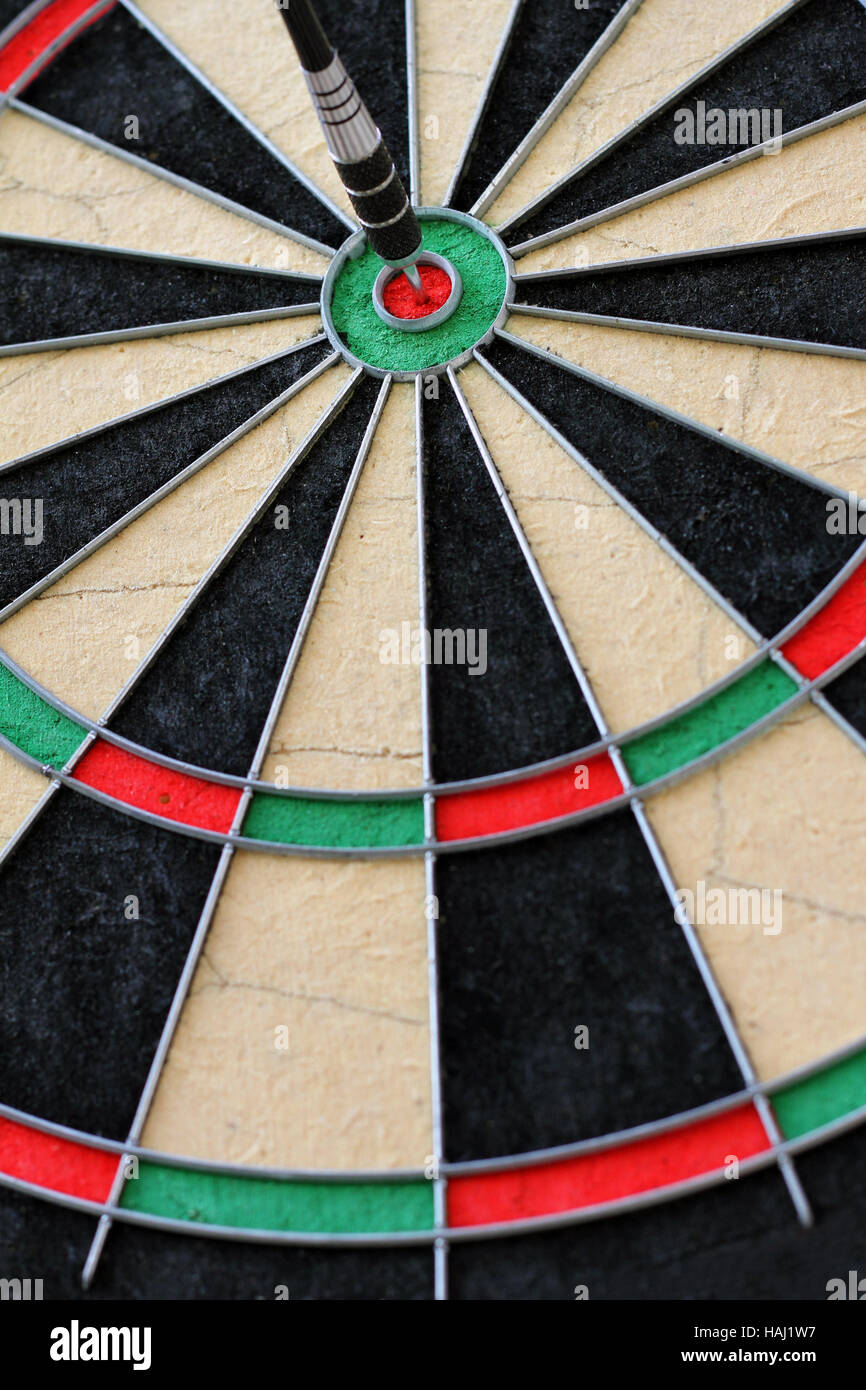 dartboard with dart in the center Stock Photo