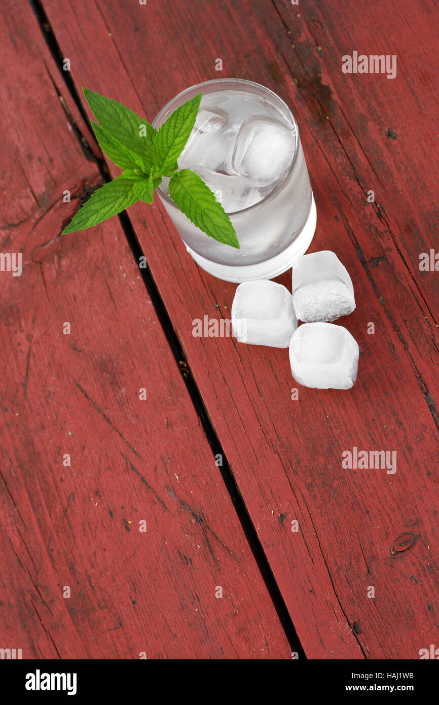 glass of water with ice cubes and mint leaf Stock Photo