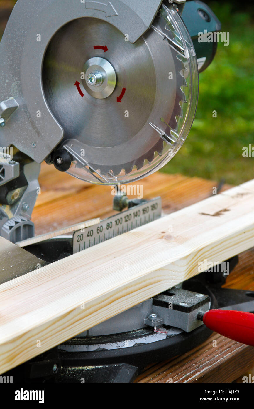 portable circular saw and wood plank Stock Photo