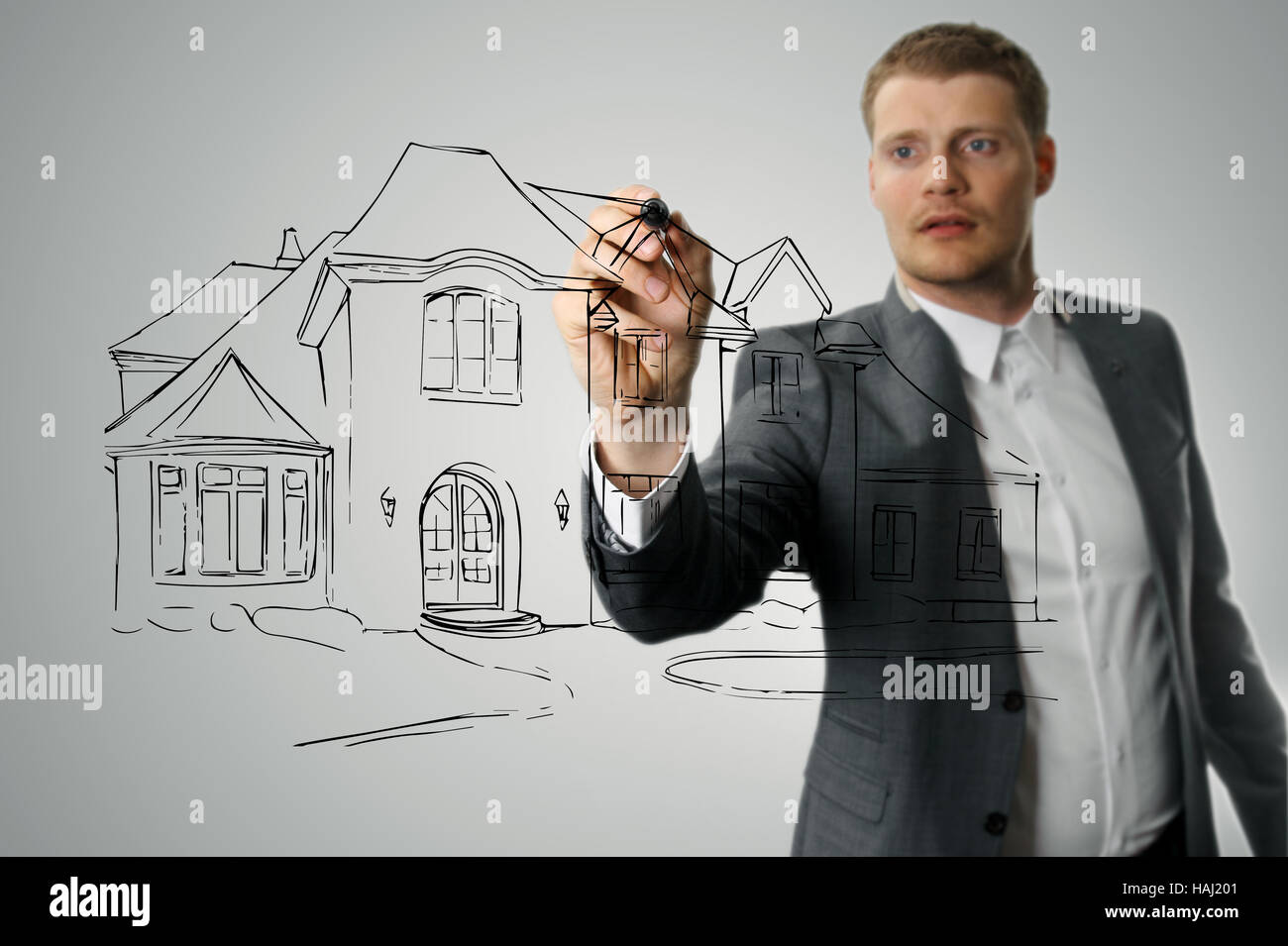 architect drawing house development sketch Stock Photo