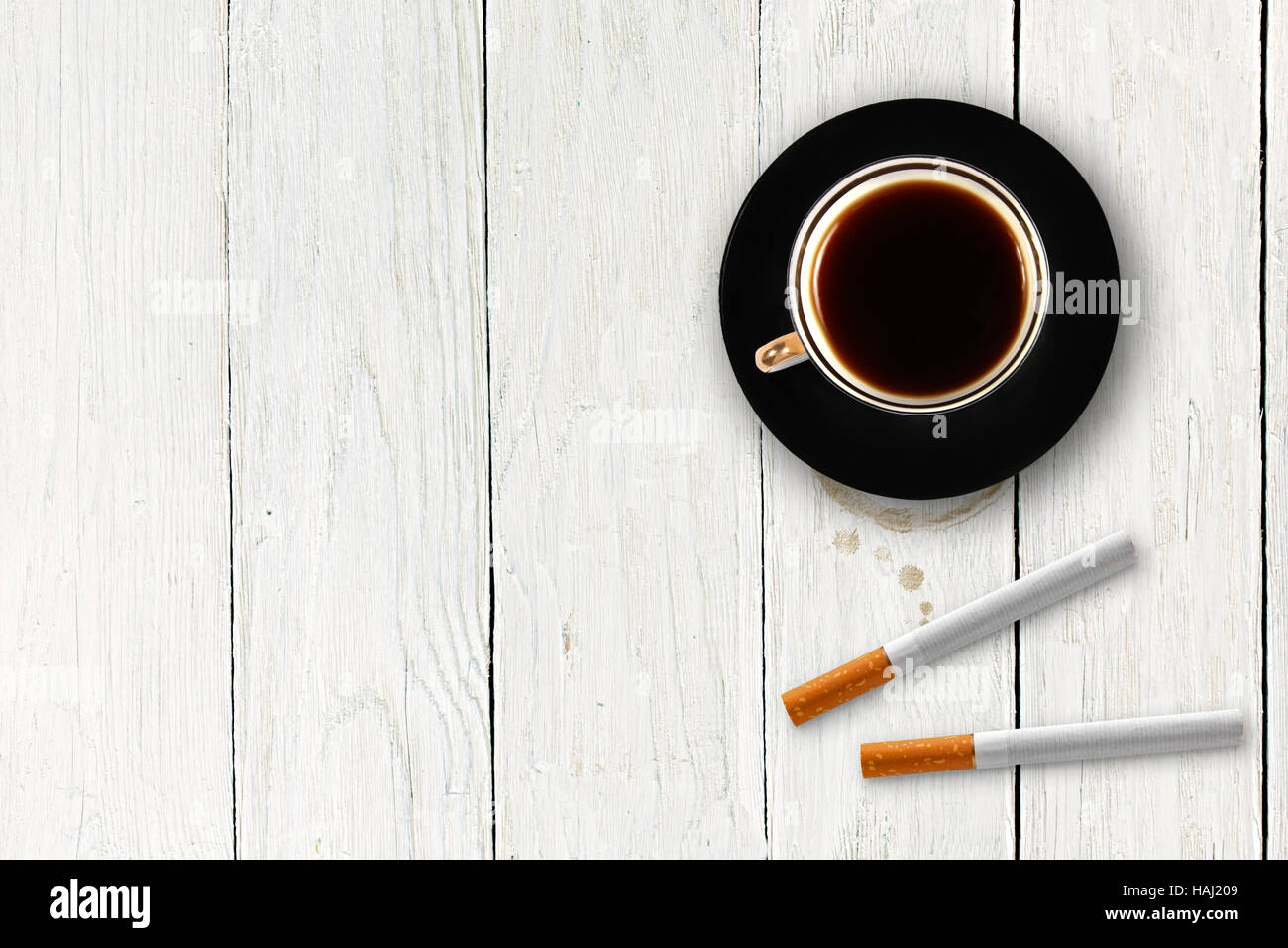 cup of coffee with cigarettes on the wooden table Stock Photo
