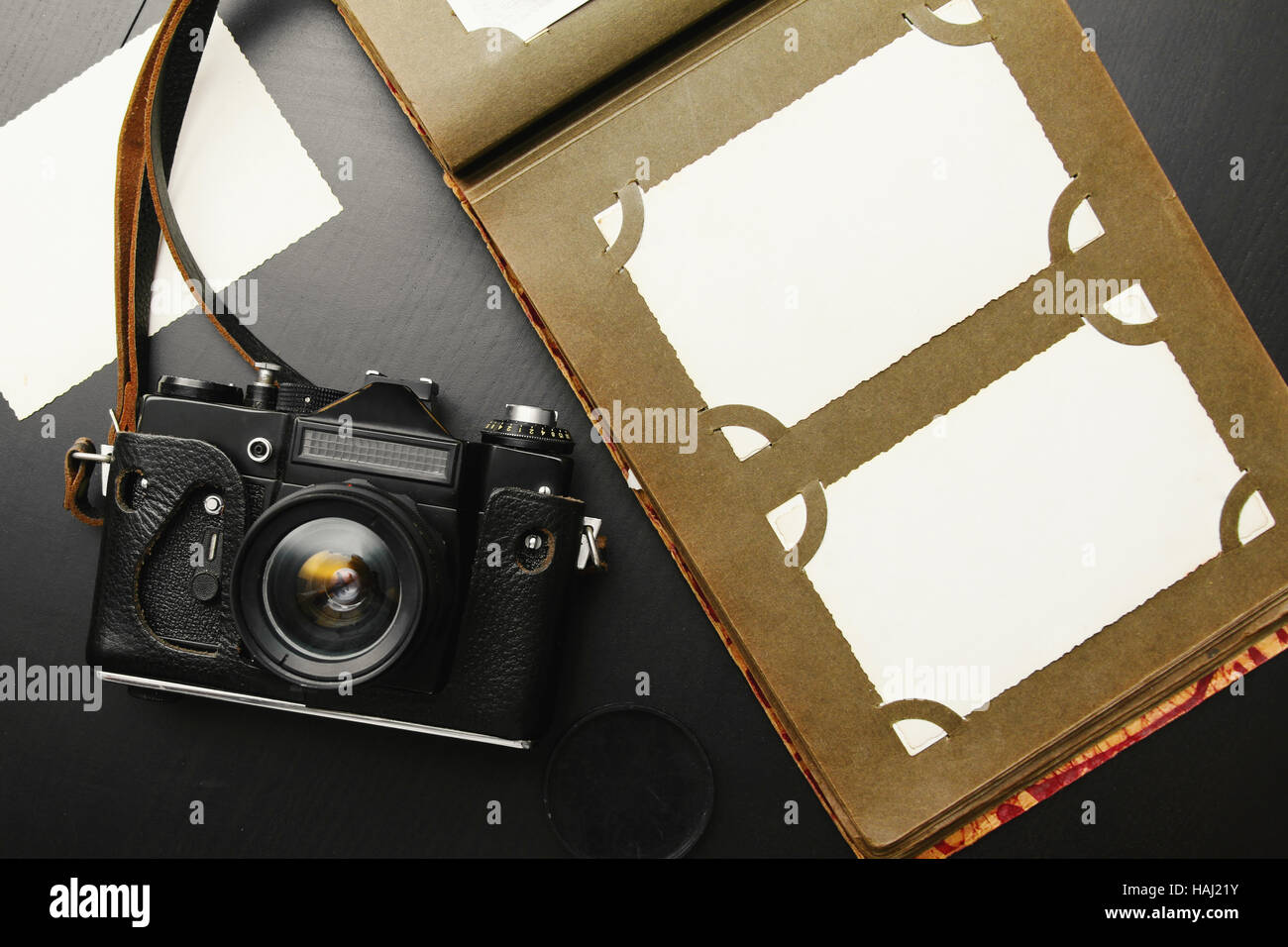 old vintage camera with album and blank pictures Stock Photo