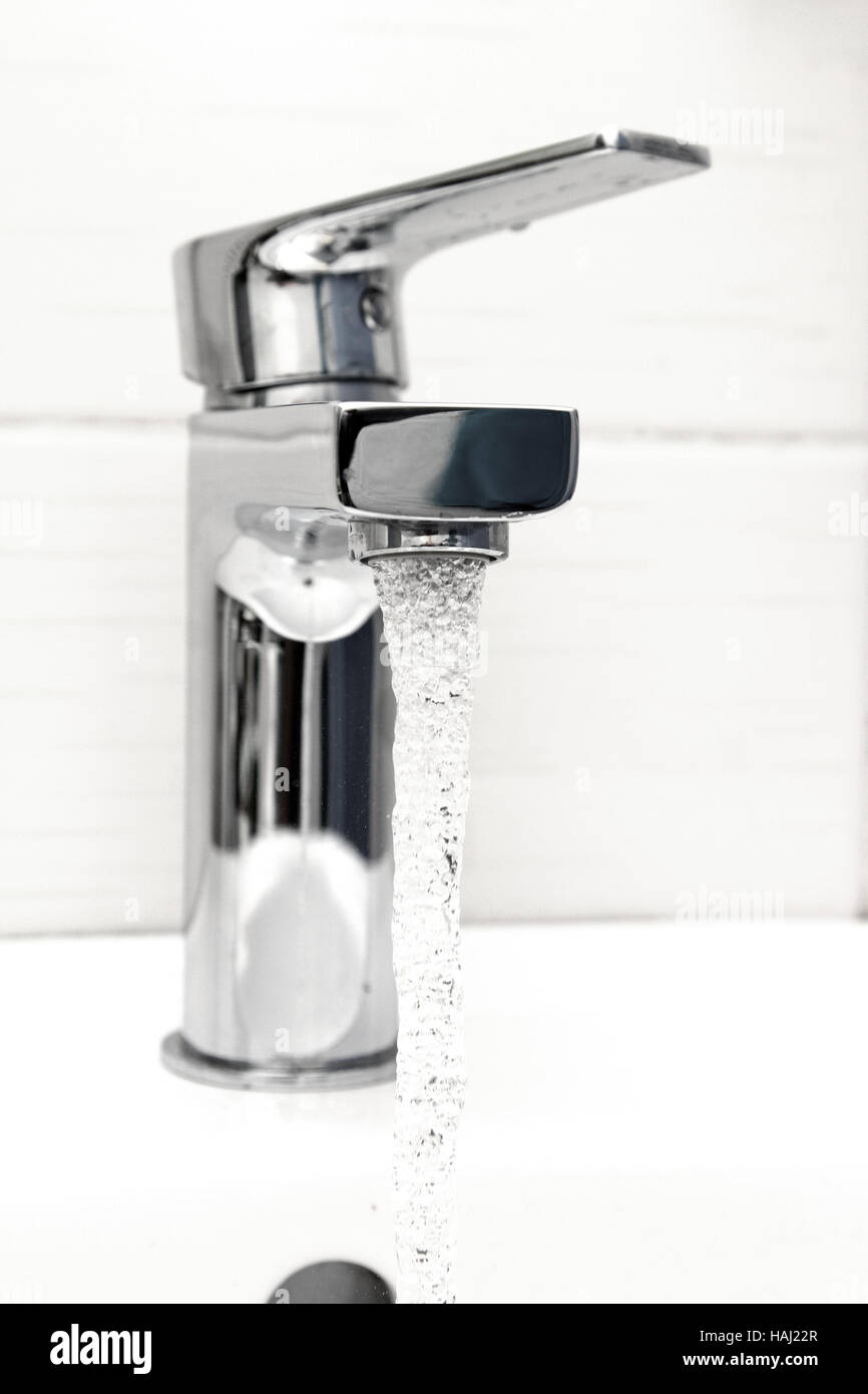 water tap with flowing water Stock Photo