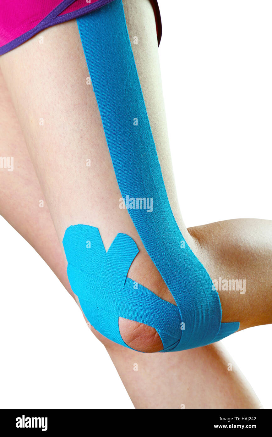 therapeutic treatment of leg with blue physio tape Stock Photo