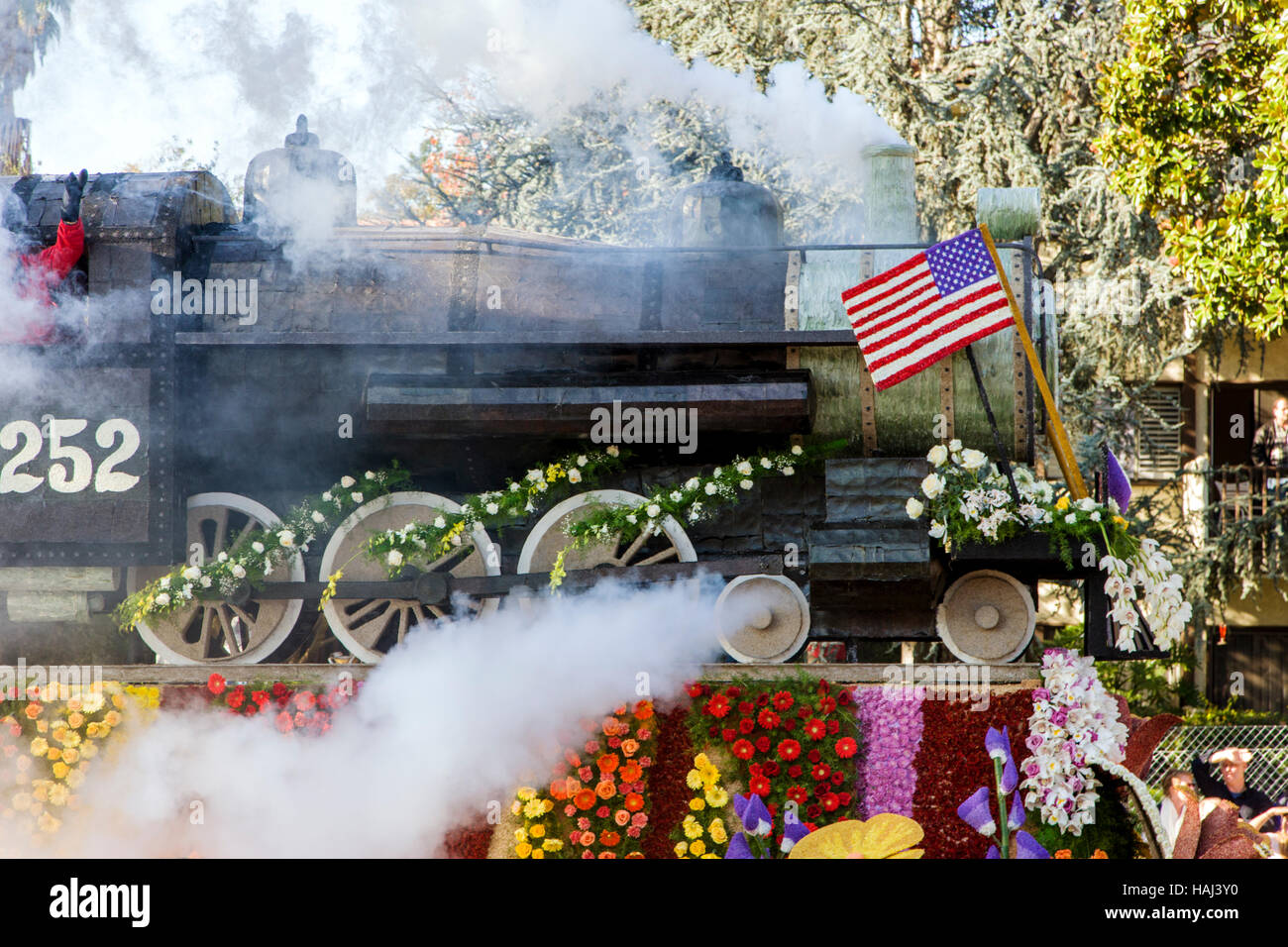 Float decorated like steam locomotive with flowers in the annual New Years Day Rose Bowl Parade, Pasadena, California, USA Stock Photo