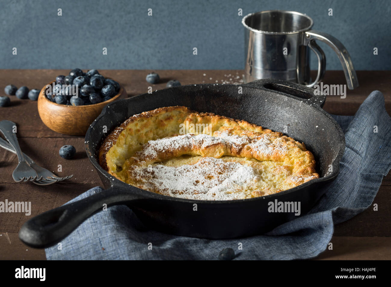 https://c8.alamy.com/comp/HAJ4PE/homemade-dutch-baby-pancake-with-blueberries-and-powdered-sugar-HAJ4PE.jpg