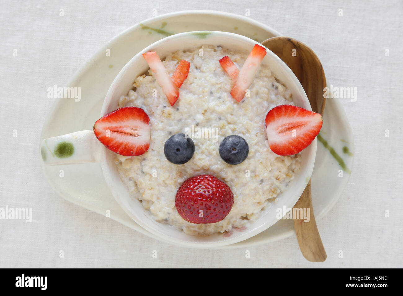 Rudolph The Red Nosed Reindeer porridge oatmeal breakfast , Fun Christmas food art for kids Stock Photo