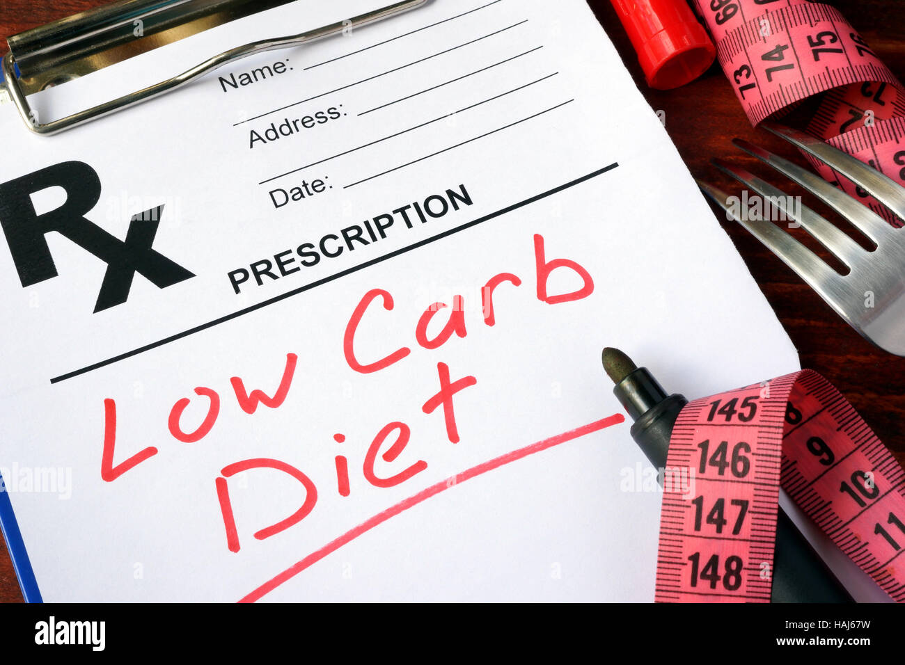 Prescription form with words low carb diet. Stock Photo
