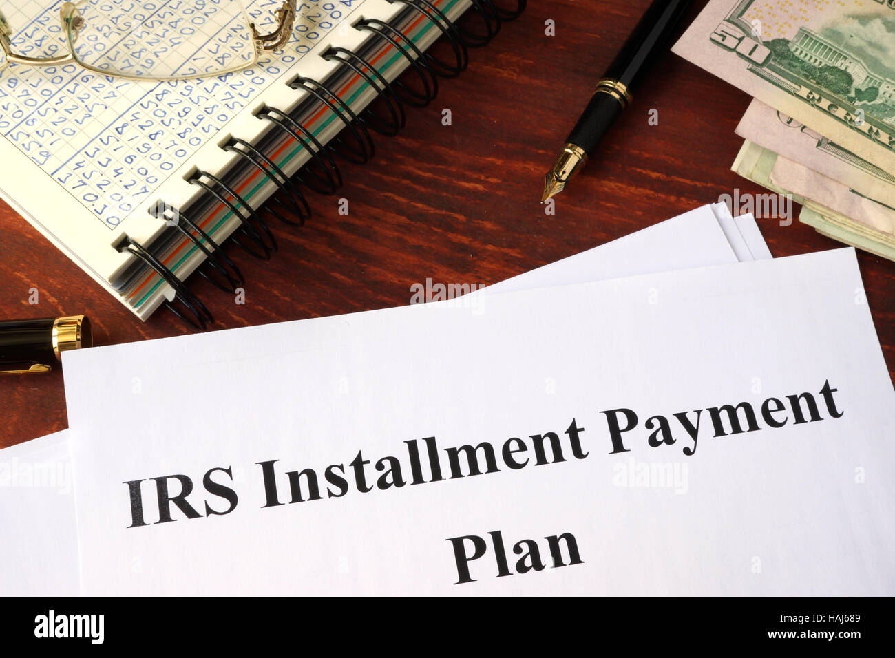 Papers with title IRS Installment Payment Plan Stock Photo
