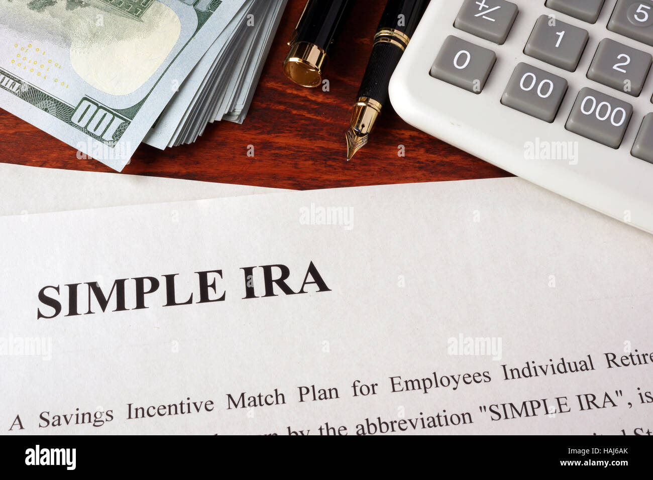 Papers with simple ira and book on a table. Stock Photo