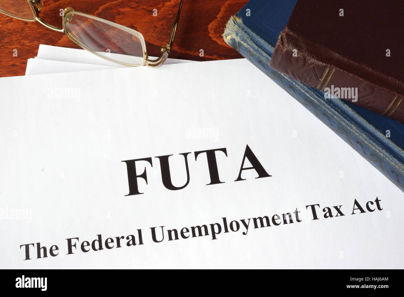 Papers with FUTA Federal Unemployment Tax Act. Stock Photo