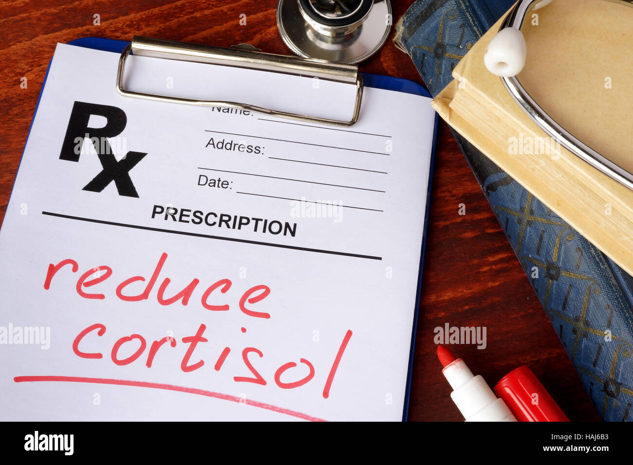 Prescription form with words reduce cortisol. Medical concept. Stock Photo