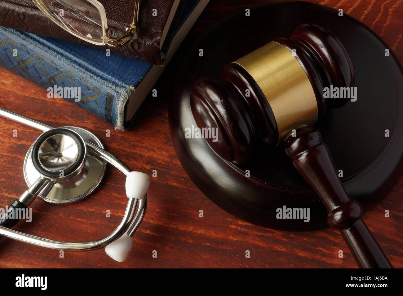 Medical error concept. Stethoscope and gavel on a table. Stock Photo