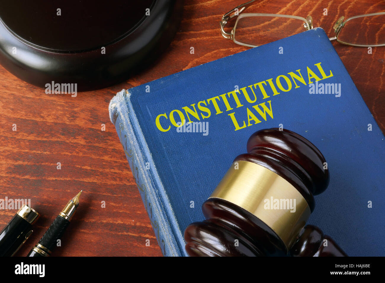 Title constitutional law on a book and a gavel. Stock Photo