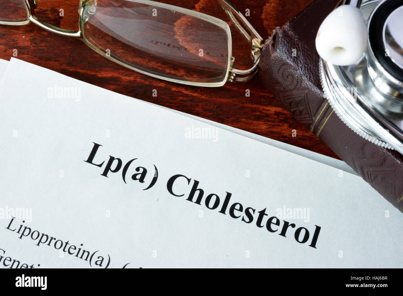 Papers with words Lp(a) Cholesterol on a table. Stock Photo