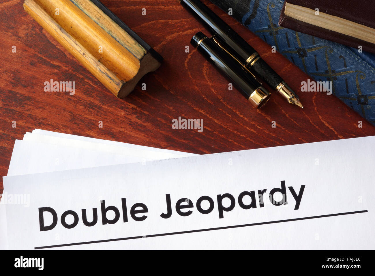 Papers with title Double Jeopardy on a table. Stock Photo