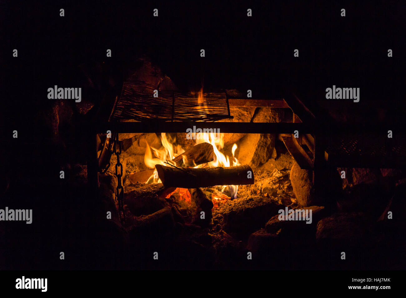 Camping outdoors lighting a campfire for warmth Stock Photo