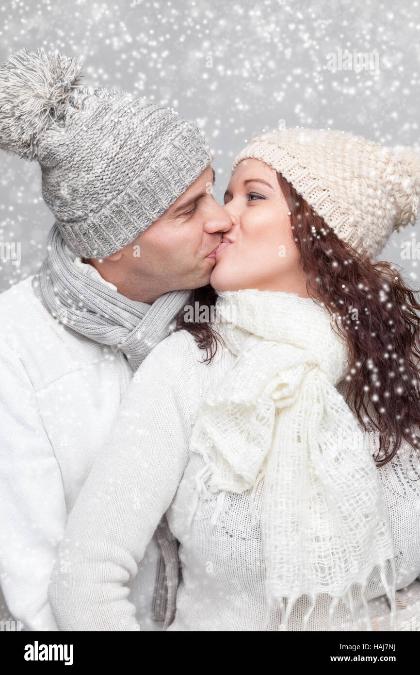 Young happy couple dressed in warm clothes in winter Stock Photo
