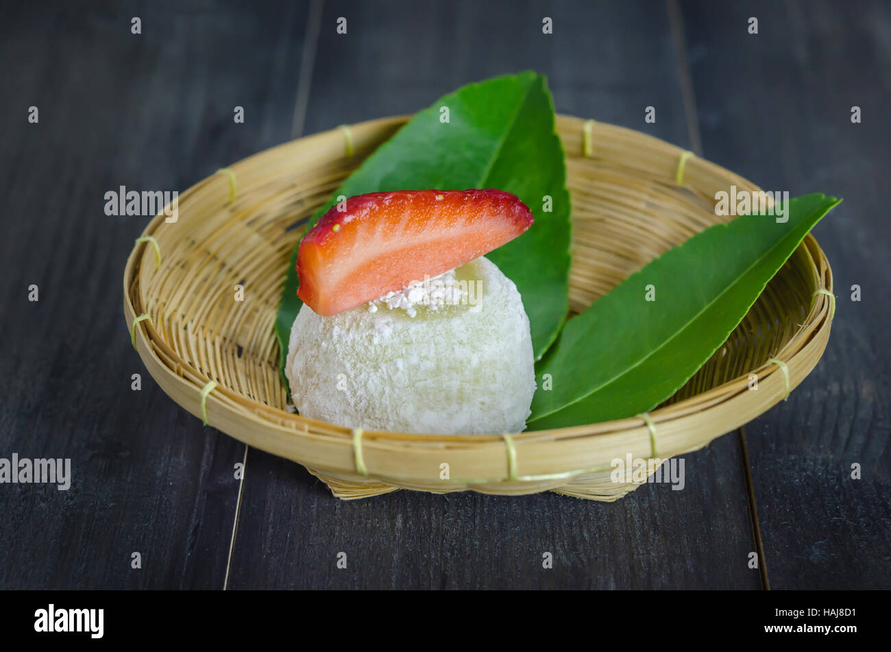 Strawberry Daifuku Mochi Japanese dessert on bamboo basket , still life