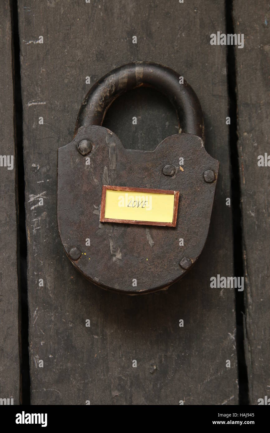 Love text and old padlock, wedding, Valentine card Stock Photo