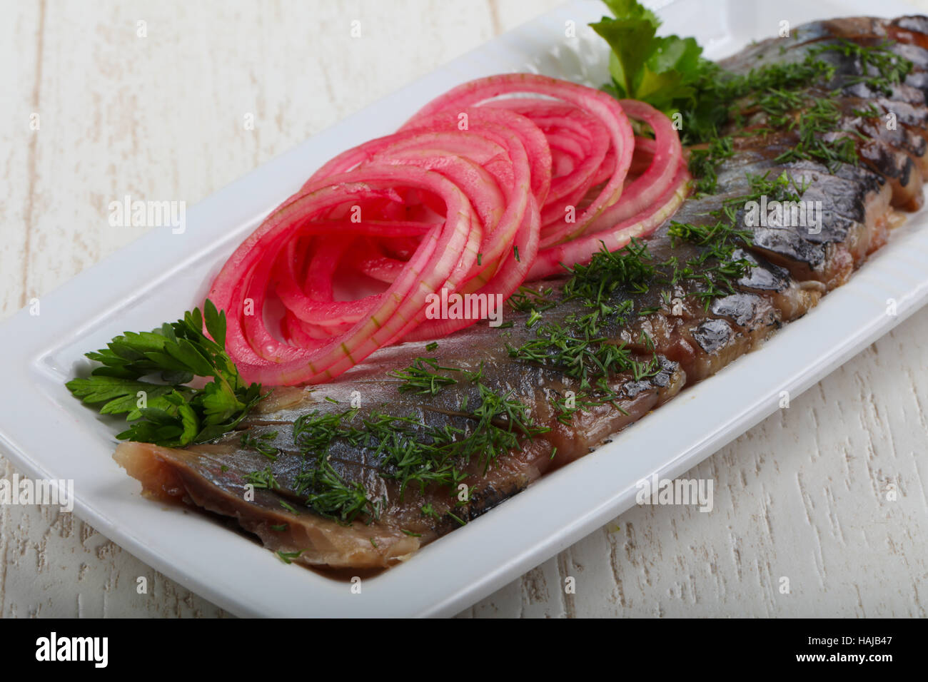 Herring fillet with pickled red onion and dill Stock Photo Alamy