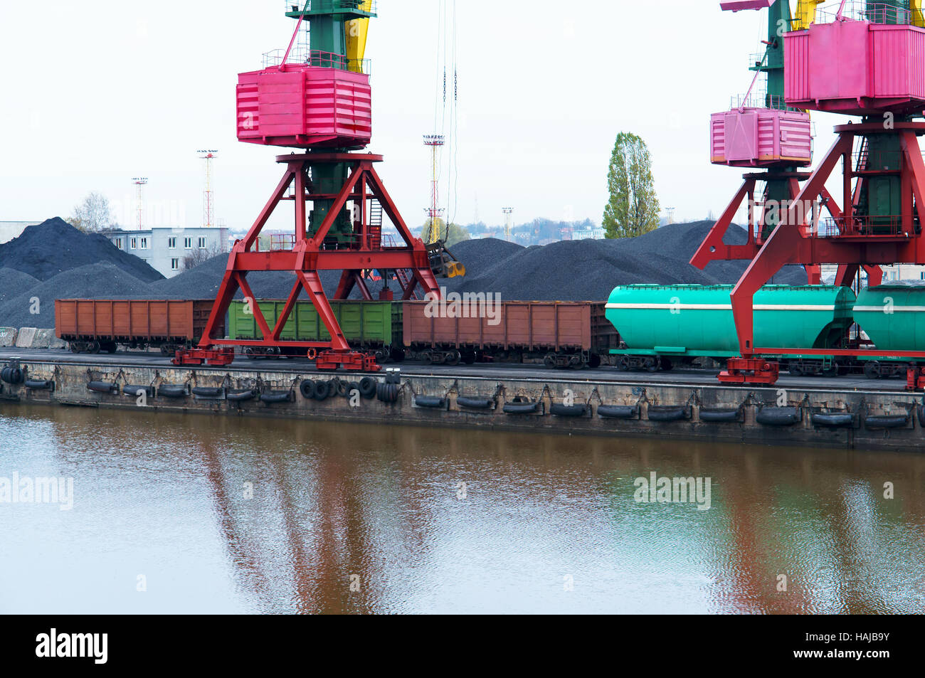 cranes at the port, coal, freight train, cargo terminal Stock Photo