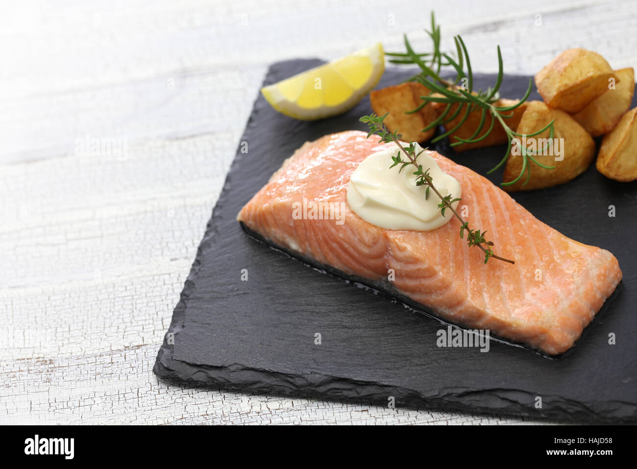 salmon steak with fried potatoes Stock Photo