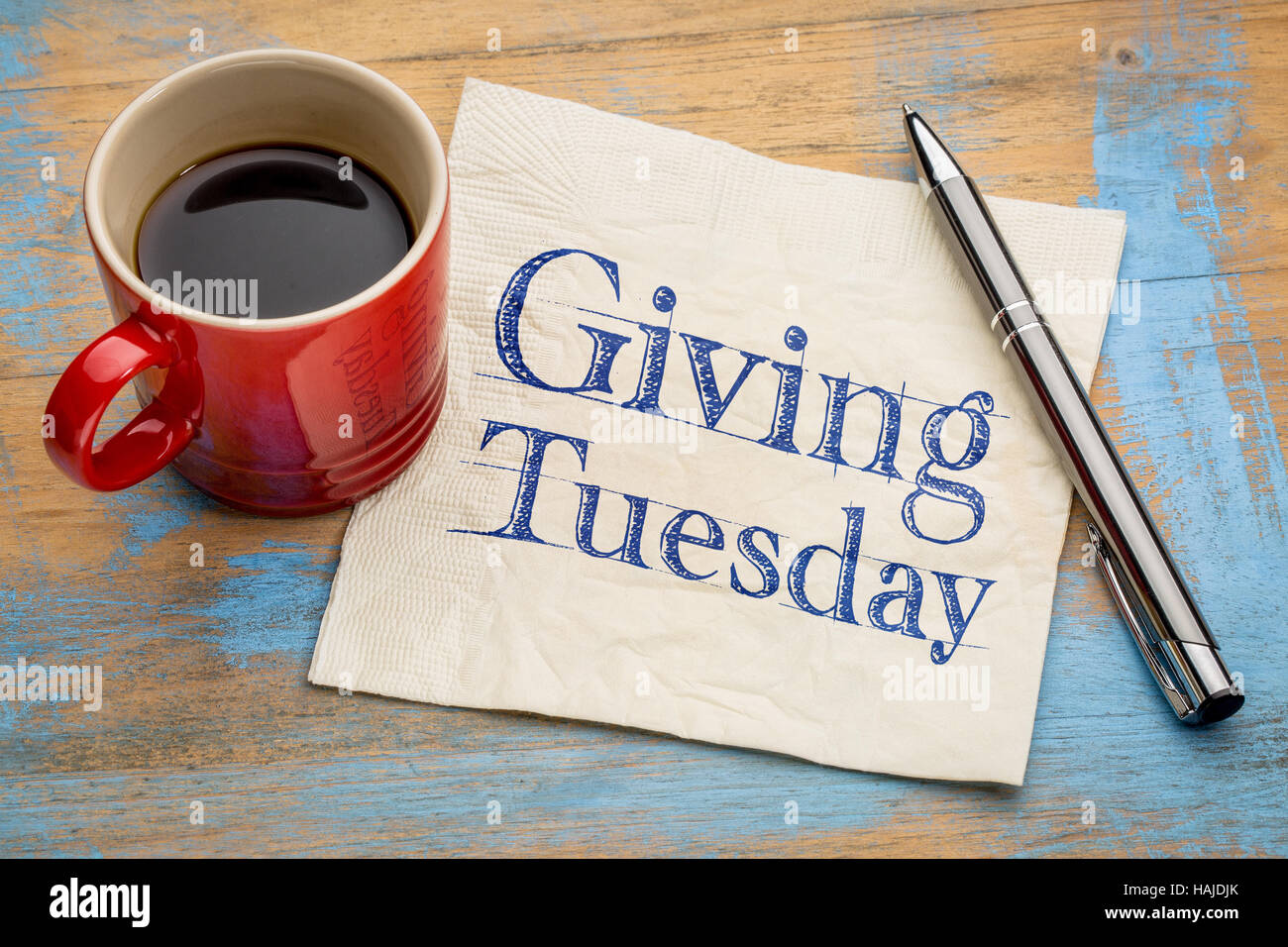 Giving Tuesday  - handwriting on a napkin with a cup of espresso coffee Stock Photo