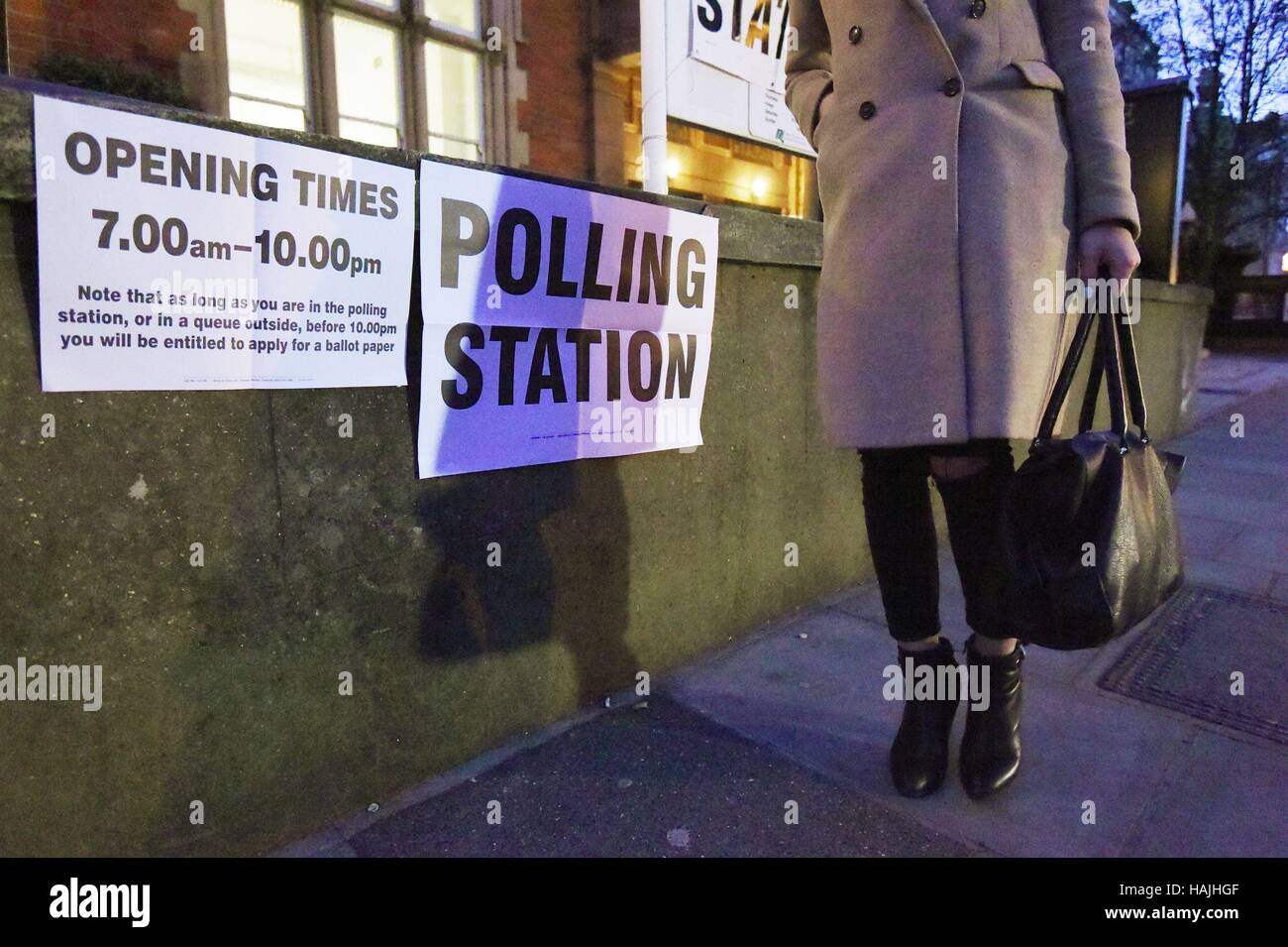 A person walks outside a polling station in Richmond, south west London, for a by-election where former Conservative Zac Goldsmith is trying to see off a Liberal Democrat challenge as he fights to retain the parliamentary seat he quit in protest over airport expansion. Stock Photo