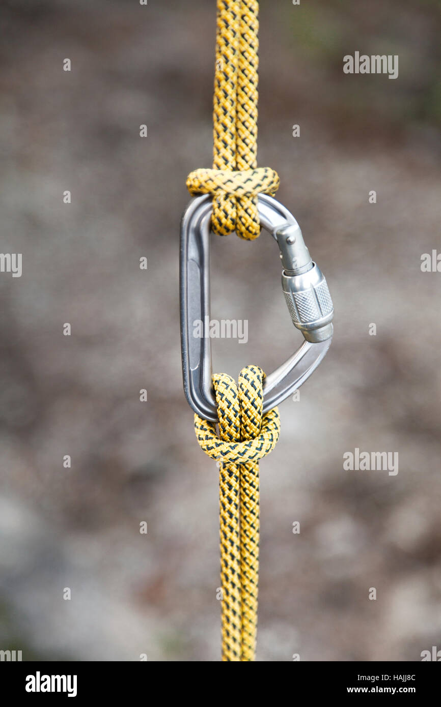 Rock climbing carabiner with ropes Stock Photo Alamy