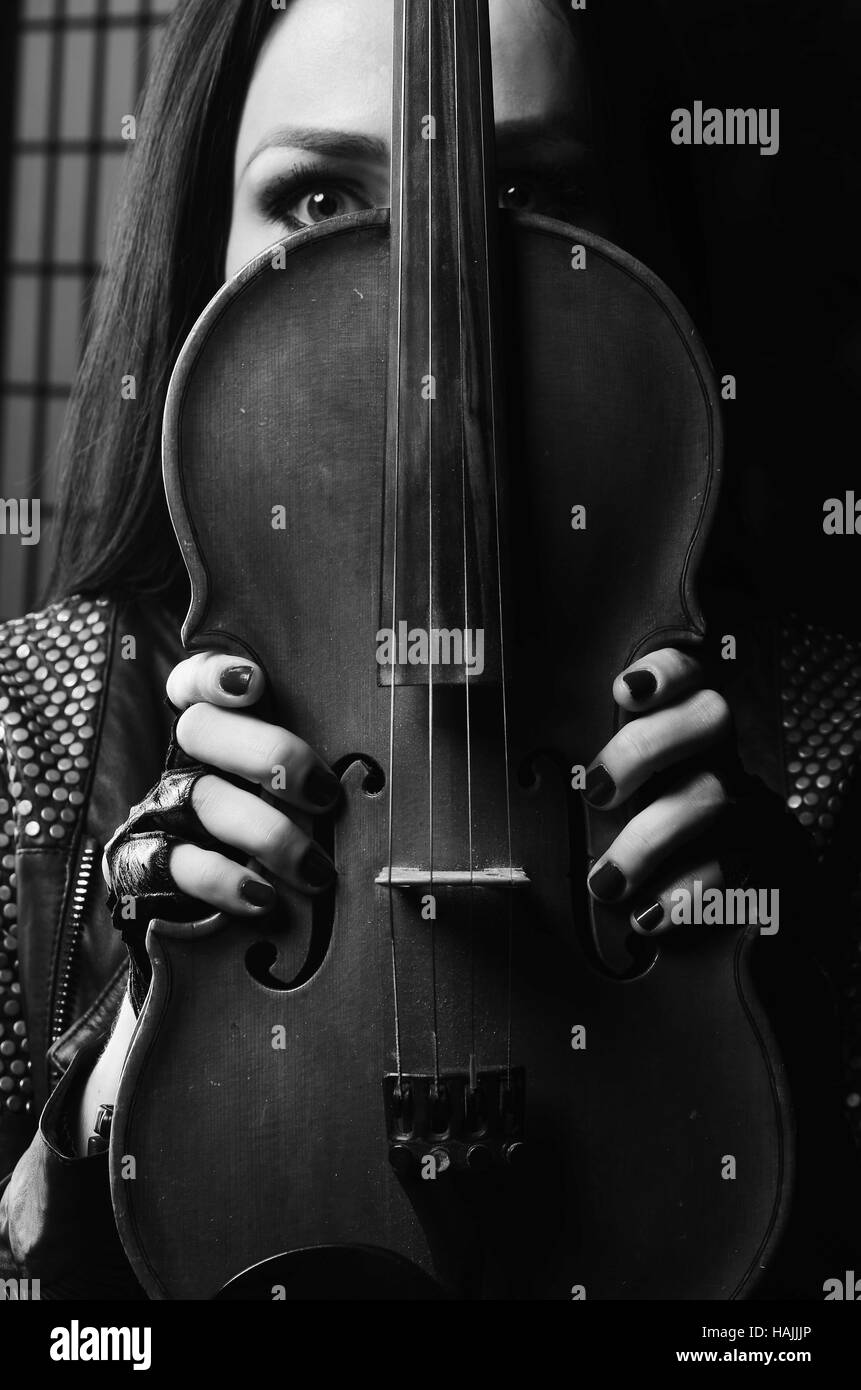 beautiful girl touch violin in the hands Stock Photo