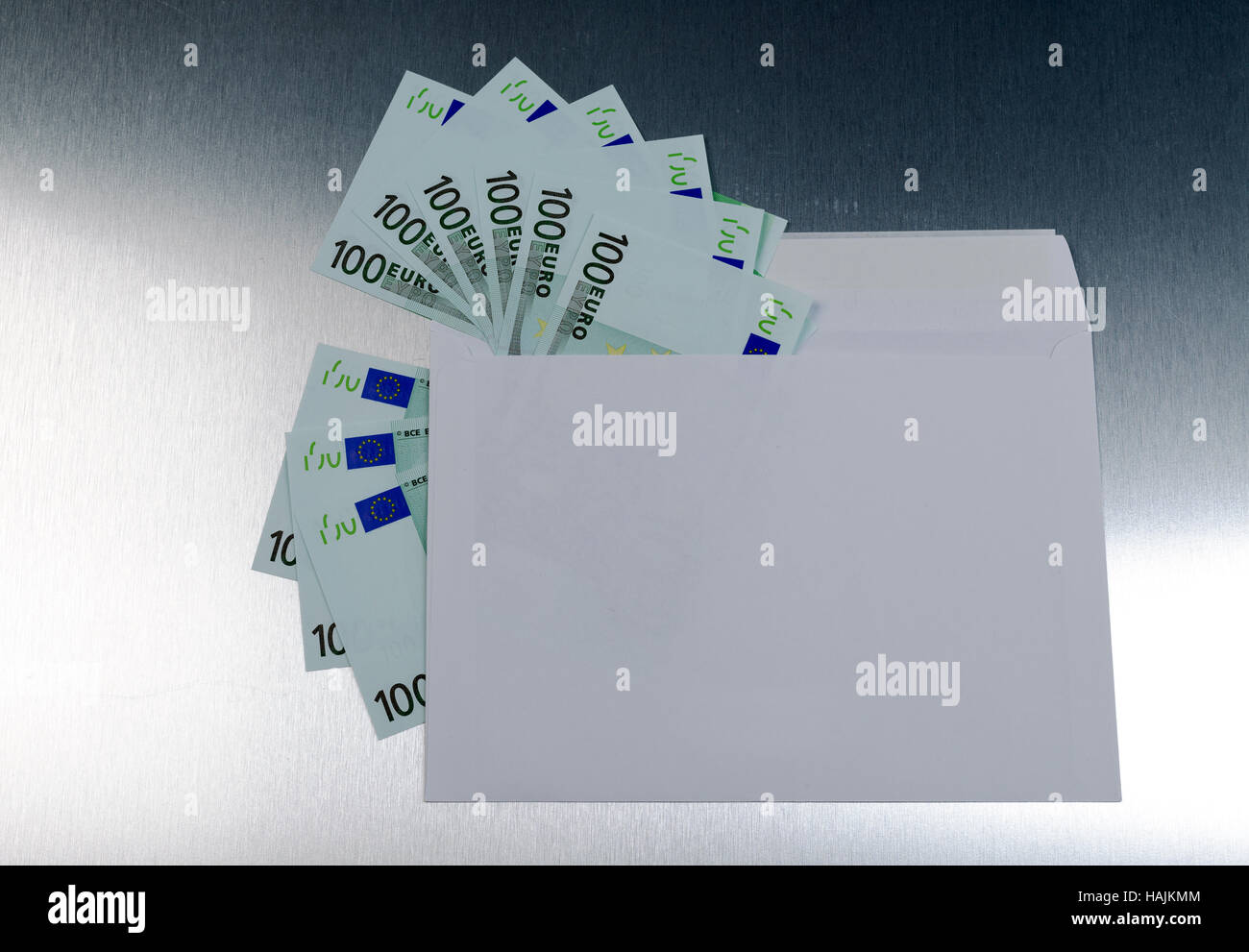 Euro banknotes in envelope over a metall background Stock Photo