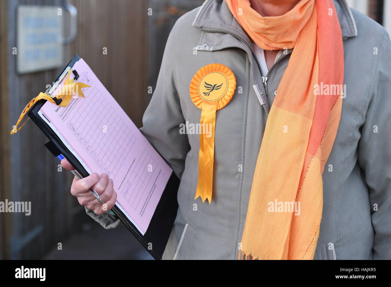 A Lib Dem supporter outside a polling station in Richmond, south west London, for a by-election where former Conservative Zac Goldsmith is trying to see off a Liberal Democrat challenge as he fights to retain the parliamentary seat he quit in protest over airport expansion. Stock Photo