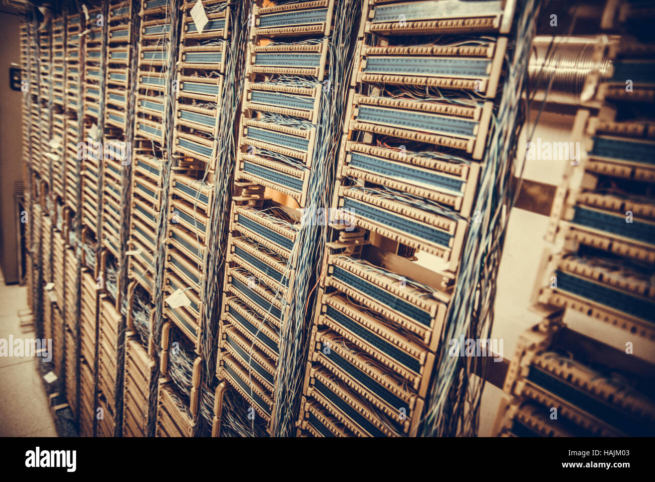 Color image of an old telephone exchange wit many wires. Stock Photo