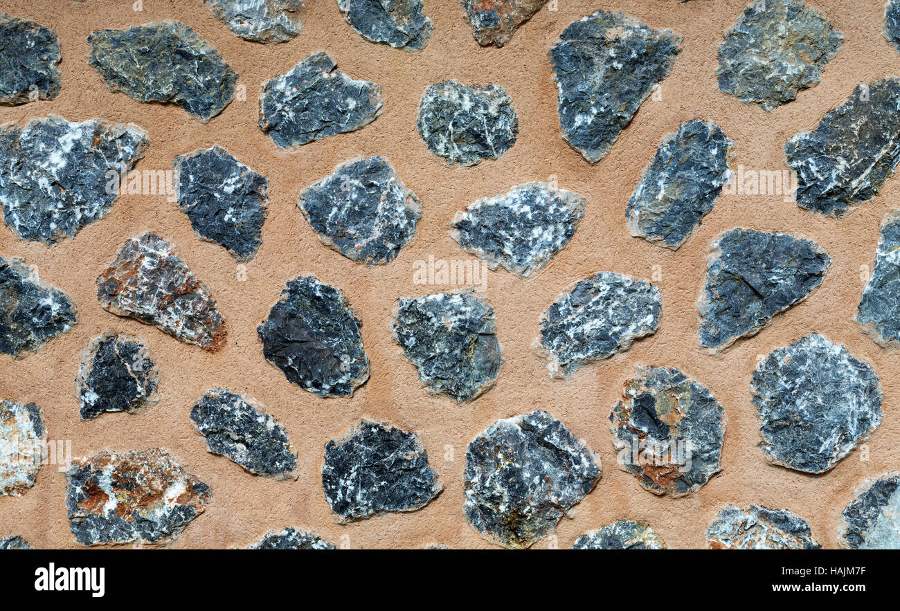 Background of the stones in the sand cement wall Stock Photo - Alamy