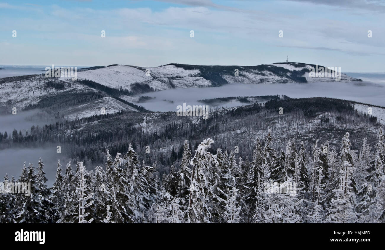 winter Beskid Slaski mountains panorama with highest Skrzyczne hill from view tower on Barania Gora hill near Wisla resort with snow and blue sky Stock Photo