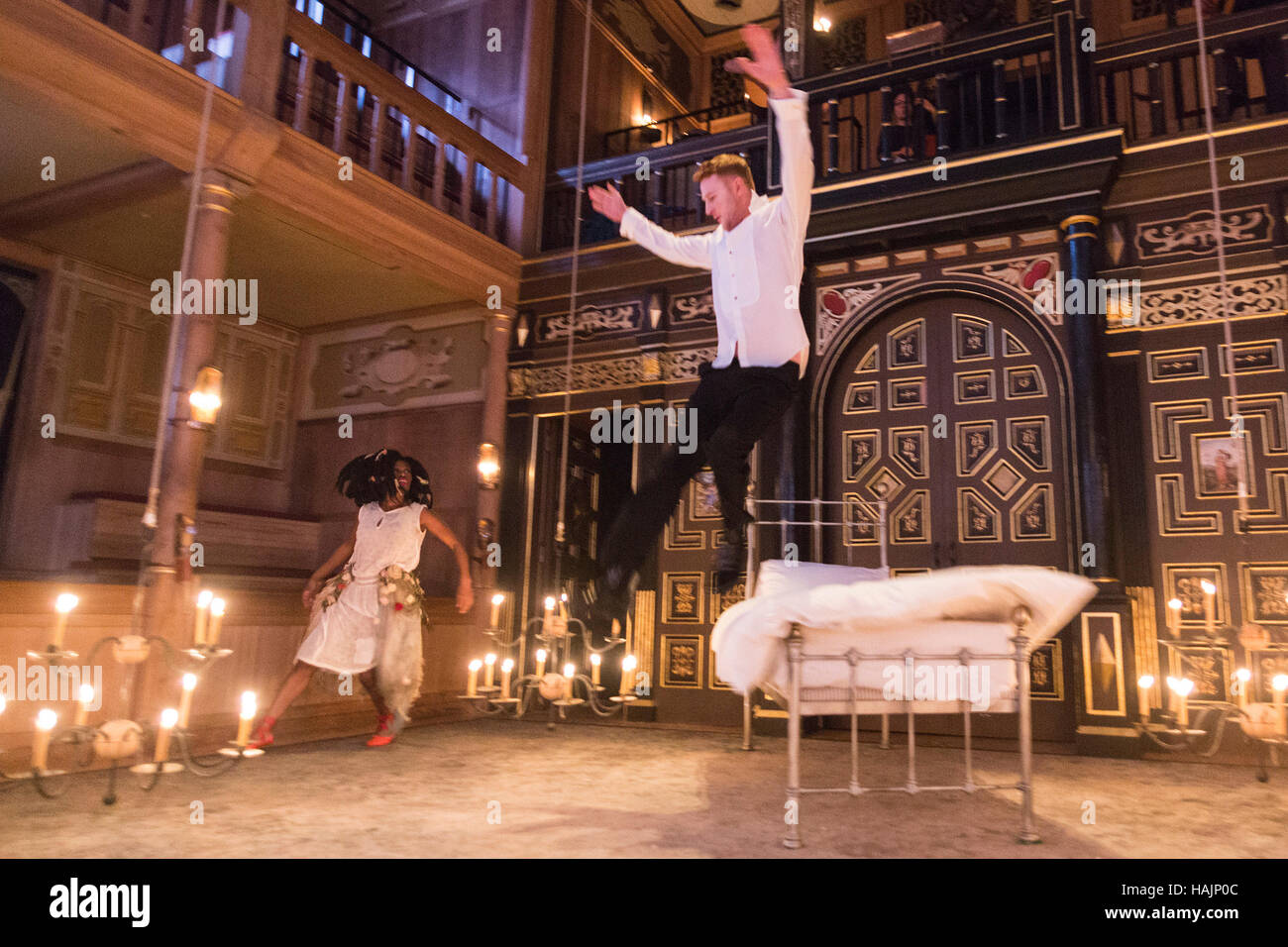 London, UK. 30 November 2016. Jack Shalloo as Prince and Akiya Henry as Princess performing the story Princess and the Pea. The Sam Wanamaker Playhouse presents The Little Matchgirl and Other Happier Tales from the stories of Hans Christian Andersen. Written an co-adapted by Joel Horwood, direction and co-adapted by Emma Rice. Performances from 24 November 2016 to 22 January 2017. Performers: Paul Hunter, Japjit Kaur, Akiya Henry, Bettrys Jones, Kyle Lima, Jack Shalloo and puppeteer Edie Edmundson. Stock Photo