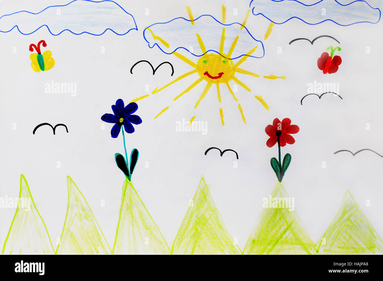 Childish colored drawing of funny sun flowers and clouds Stock Photo