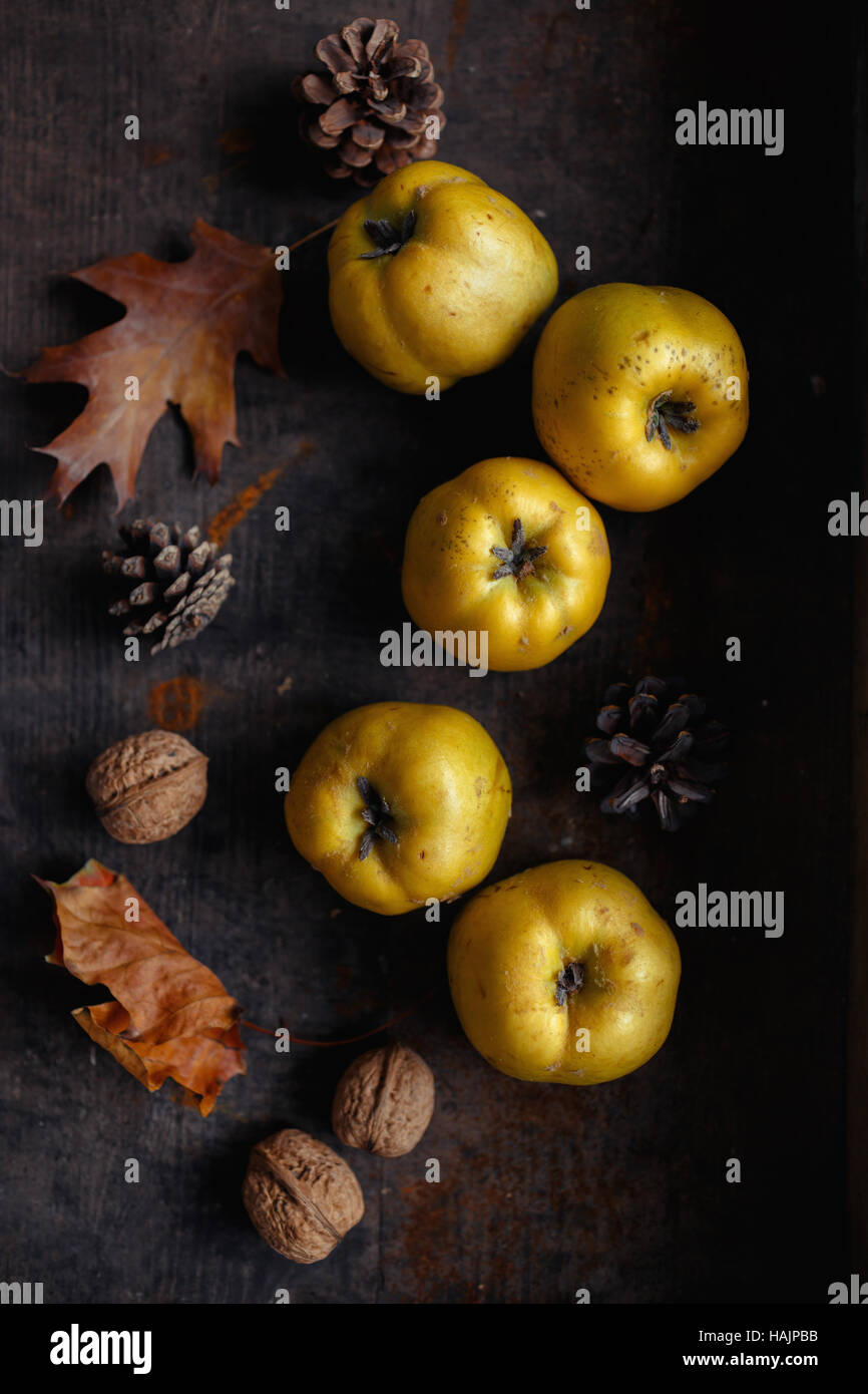 An autumn still life with quinces on wood Stock Photo