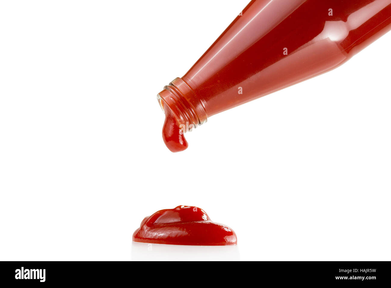 Tomato ketchup falling from bottle Stock Photo Alamy