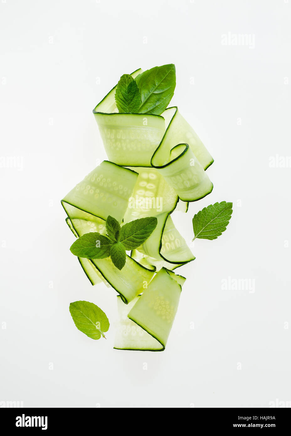 Cucumber noodles with mint leaves Stock Photo