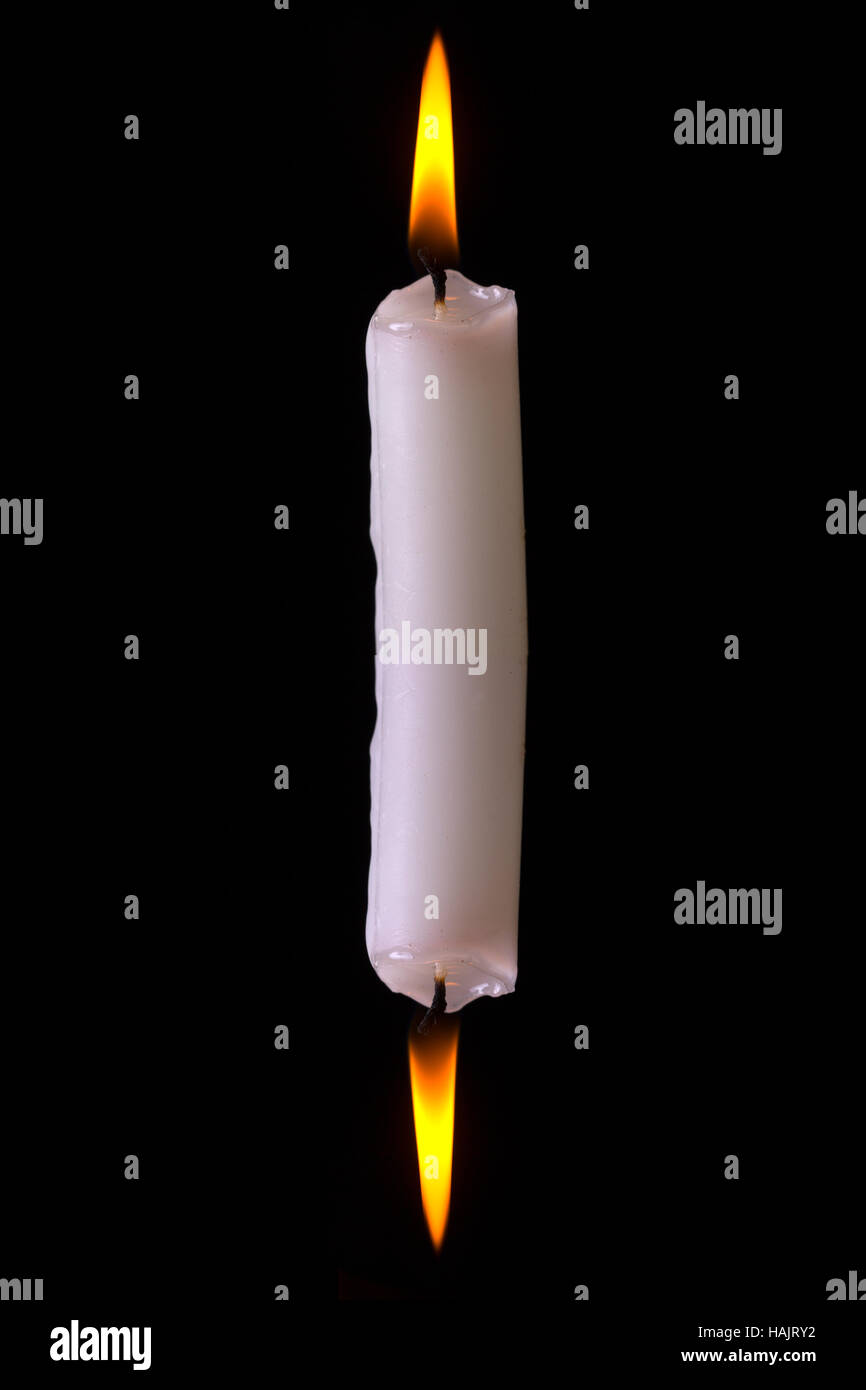 Burning a candle at both ends Stock Photo Alamy