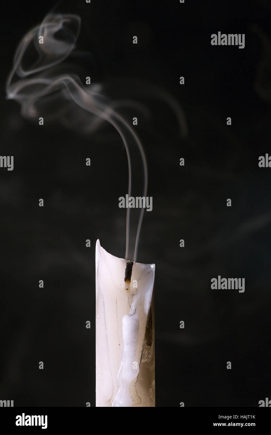A snuffed out burning candle Stock Photo Alamy